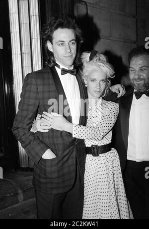 LONDON, UK. c. 1986: Pop star Bob Geldof & wife Paula Yates at party at Langan's Brasserie in London. © Paul Smith/Featureflash Stock Photo