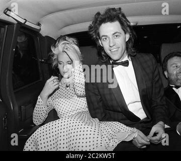 LONDON, UK. c. 1986: Pop star Bob Geldof & wife Paula Yates at party at Langan's Brasserie in London. © Paul Smith/Featureflash Stock Photo