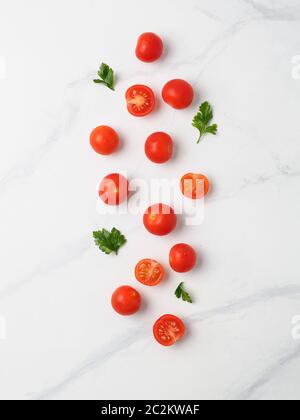 Cherry tomatoes on white marble table Stock Photo