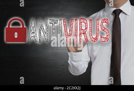 Antivirus is written by businessman on screen. Stock Photo