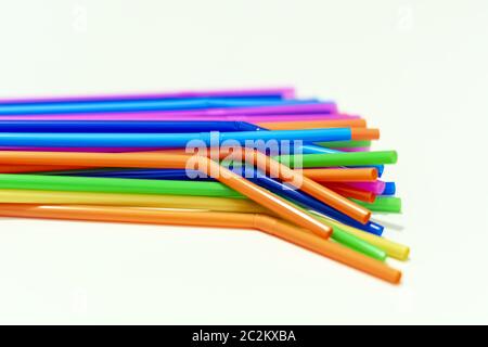 group of plastic straws of various colors on a white background. Stock Photo