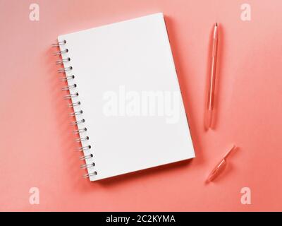 Top view of blank note on living coral background Stock Photo