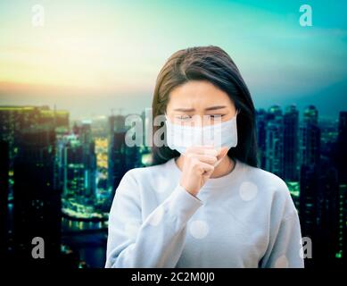 Asian  woman suffer from cough with face mask protection Stock Photo