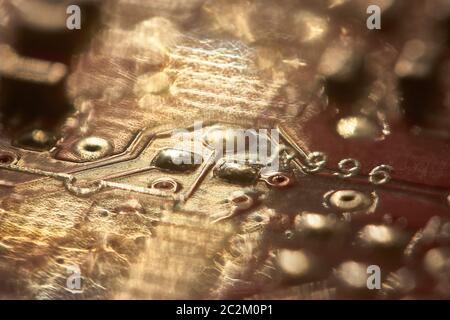 electronic background: Internal components of a printed circuit with solders and various components. Stock Photo
