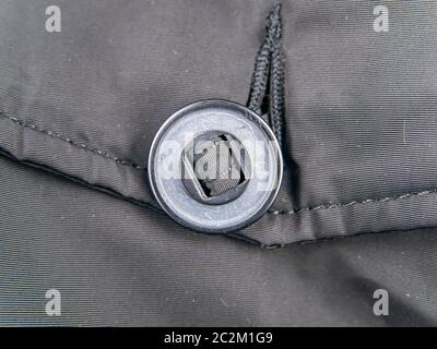 A large button on clothes. Clothing. Stock Photo