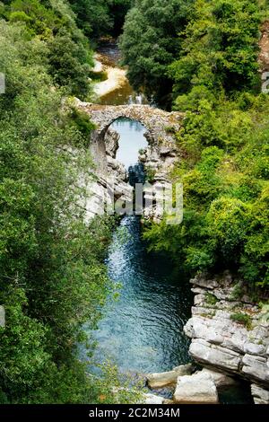A medieval bridge on Calore River near Felitto in Cilento National Park, Campania, italy Stock Photo