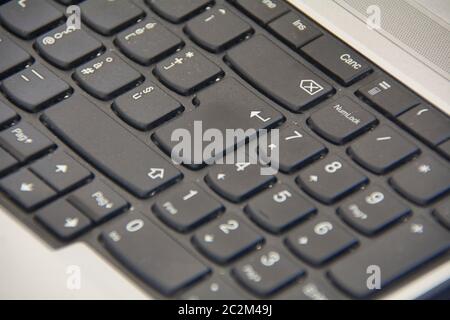 Detail of the enter key on a laptop keyboard. Stock Photo