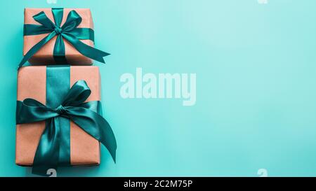 Gift boxes in craft paper and satin ribbon, banner Stock Photo