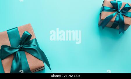 Gift boxes in craft paper and satin ribbon, banner Stock Photo