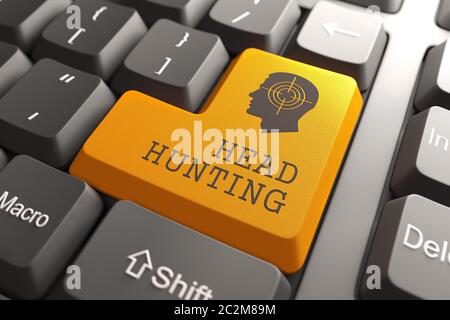 Orange Headhunting Button on Computer Keyboard. Business Concept. Stock Photo