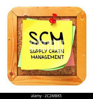 SCM - Supply Chain Management - Written on Yellow Sticker on Cork Bulletin or Message Board. Business Concept. Stock Photo