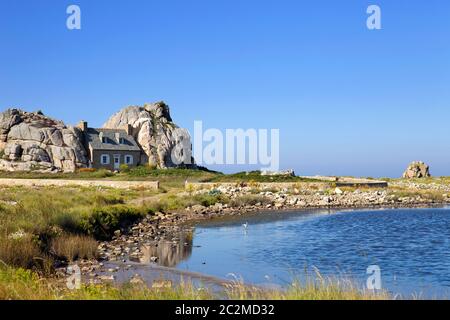 famous house on the rocks at ploumenach, cote de granit rose, cotes d'armor brittany, france Stock Photo