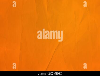 Old orange crumpled paper texture background. Wallpaper Stock Photo