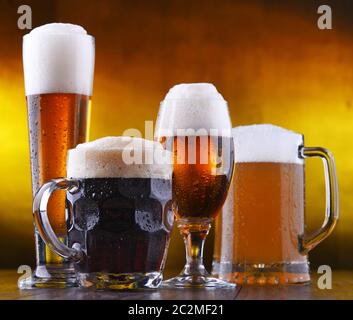 Composition with four glasses of beer. Stock Photo