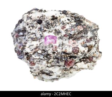 closeup of sample of natural mineral from geological collection - ruby and corundum crystals in unpolished gneiss rock isolated on white background Stock Photo