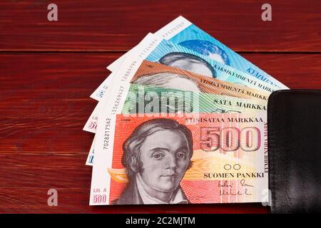 Finnish markka in the black wallet on a wooden background Stock Photo -  Alamy