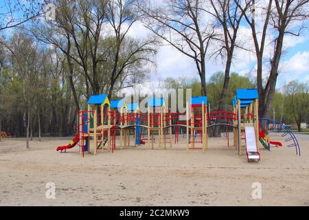 Childish playground in city park. Swing carousel in park for children. Children's playground bright Stock Photo