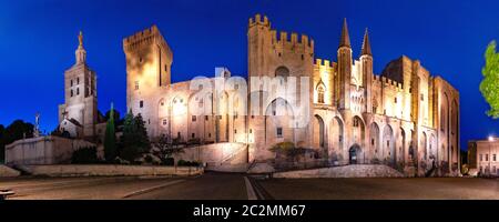 Panorama of palace of the Popes, once fortress and palace, one of largest and important medieval Gothic buildings in Europe, at night, Avignon, France Stock Photo