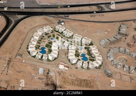 View of Egyptian resorts with swimming pools from plane. Tropical resorts, aerial view Stock Photo