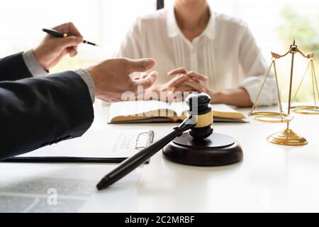 business people and lawyers discussing contract papers sitting at the table. Concepts of law, advice, legal services, legal and judgment concept Stock Photo