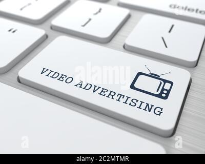 Video Advertising - Button with TV Set Icon on White Computer Keyboard. Stock Photo