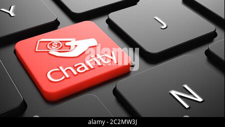Charity with Money in the Hand Icon - Red Button on Black Computer Keyboard. Stock Photo
