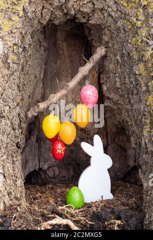 Easter decoration in a tree trunk Stock Photo