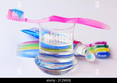 Healthy, well-kept teeth by brushing with toothbrushes and toothpaste Stock Photo