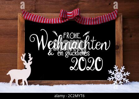 Chalkboard With German Calligraphy Frohe Weihnachten Und Ein Glueckliches 2020 Means Merry Christmas And A Happy 2020. Christmas Decoration Like Deer Stock Photo