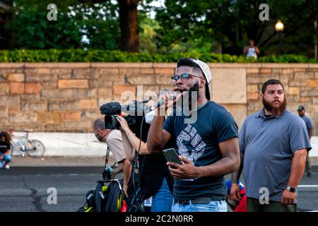 Singer Kenny Sway sings  'A Change is Gonna Come,' to protesters against police brutality on interstate 395, Washington, DC, United States Stock Photo