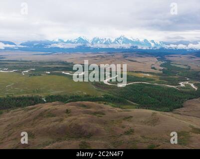 Aerial view of Kurai steppe and Chuya river on North-Chui ridge background. Altai mountains, Russia. Stock Photo