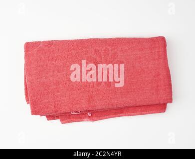 folded bath terry pink towel on a white background, top view Stock Photo