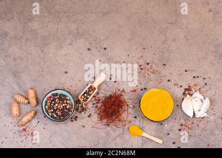 Spices on a brown textured background Stock Photo