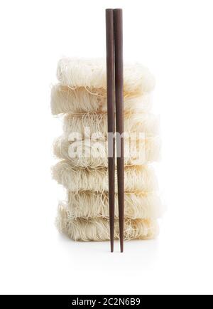 Uncooked white rice noodles isolated on white background. Stock Photo