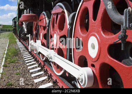Wheels and coupling devices of a big locomotive Stock Photo