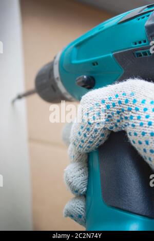 Screwdriver in the hand Stock Photo