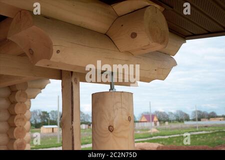 Fragment of buildings made of round logs Stock Photo