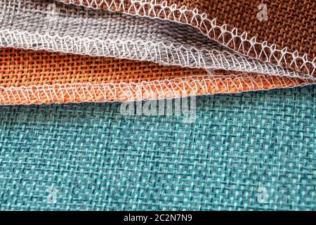Gray, orange, green and brown textiles. Fabric for decoration, embroidery, backgrounds and creative works Stock Photo