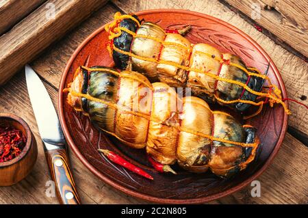 Hot smoked mackerel roll.Delicious smoked fish on plate Stock Photo