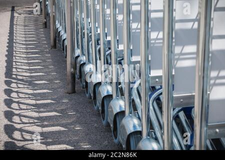 carry cart outside an airport available to travelers to move their luggage Stock Photo