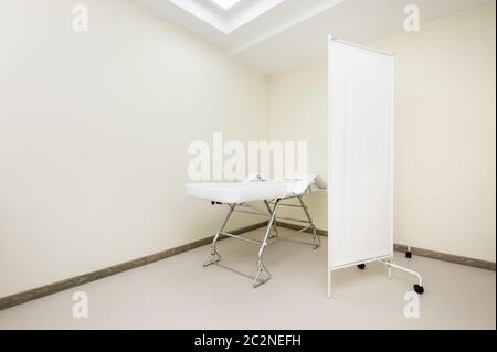 Massage room with empty table Stock Photo