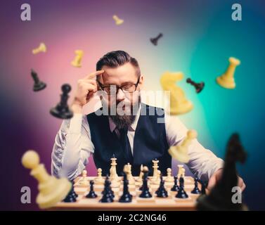 Male chess player with figures in the eyes, thinking process