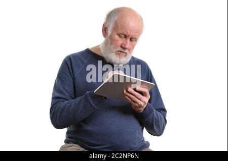 Funny old man using tablet computer isolated on white Stock Photo