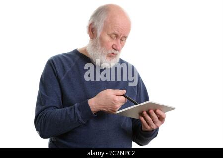 Funny old man using tablet computer isolated on white Stock Photo