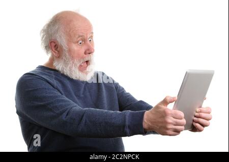 Funny shocked senior man using tablet computer isolated on white Stock Photo