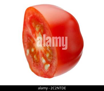 Levitating halves of cherry tomatoes close-up isolated on a white background Stock Photo