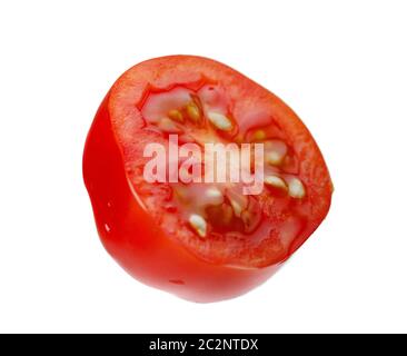 Levitating halves of cherry tomatoes close-up isolated on a white background Stock Photo