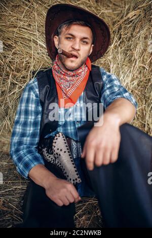 Thoughtful Cowboy Sitting On Bale Hay Stock Photo 1061542913 | Shutterstock