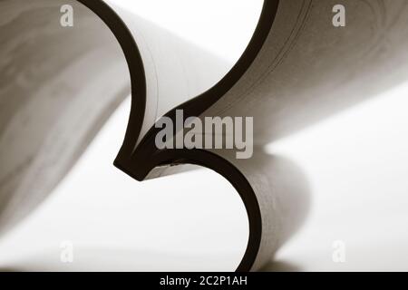 Paper sheets forming abstract curves. Toned Stock Photo