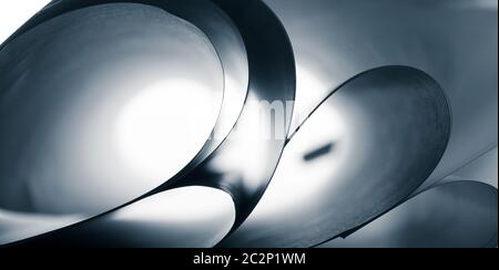 Abstract curves of paper sheets. Toned in blue Stock Photo